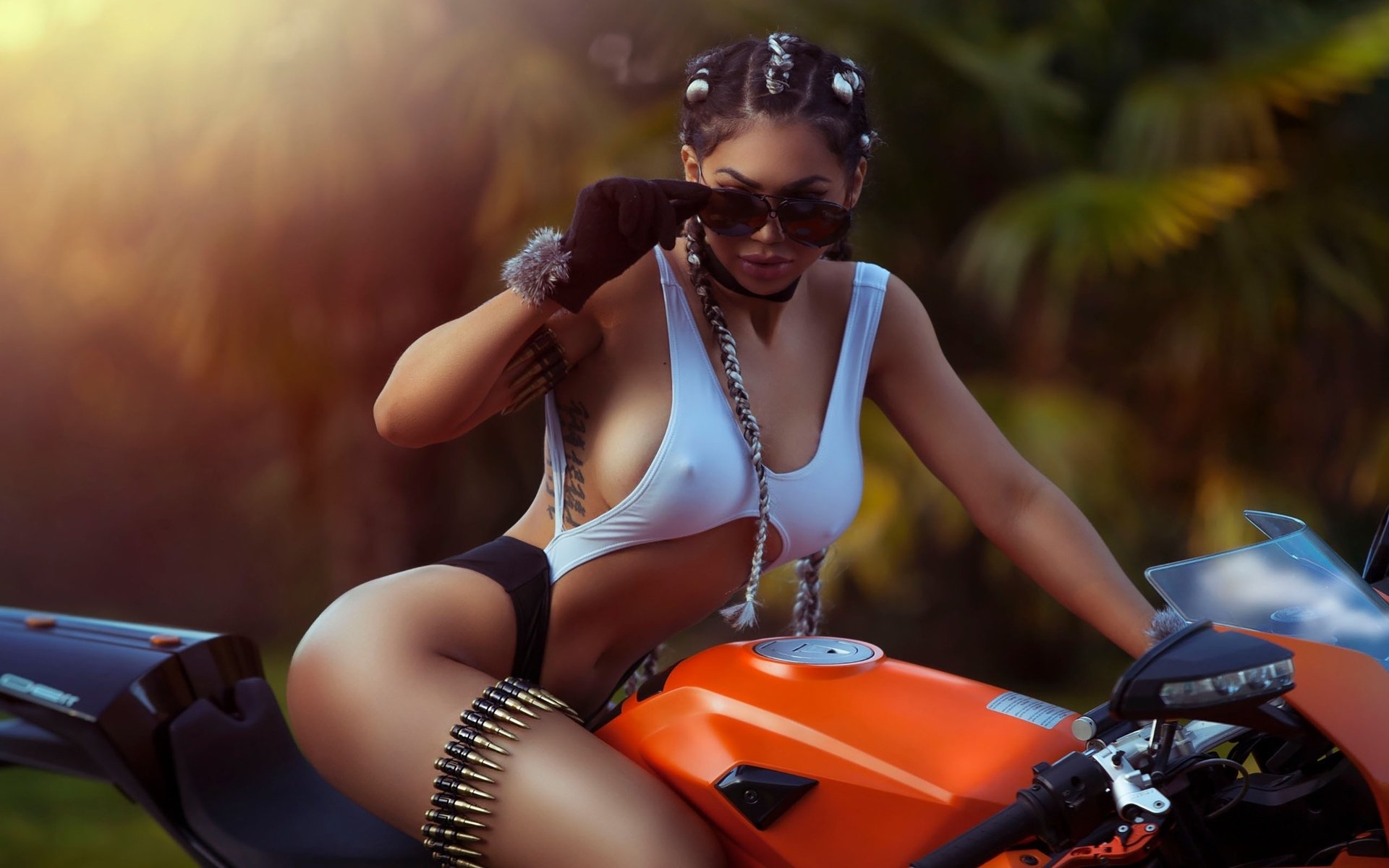 Girls with tattoos and motorcycles in Libreville